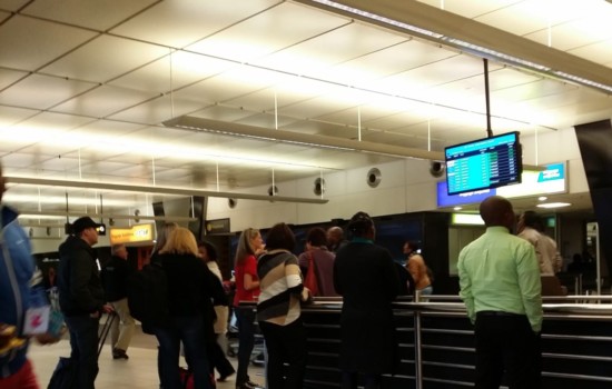 People Waiting For Passengers To Arrive At Airport