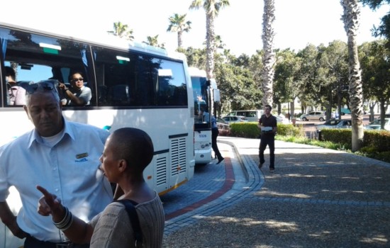 Passengers boarding their coaches at airport