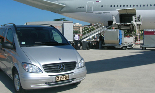 Minivan Shuttle Vehicle parked on airport tarmac