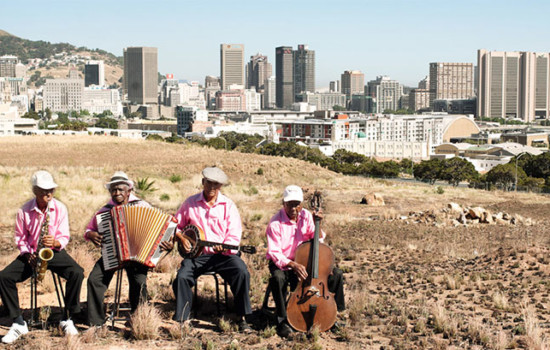 4 Musicians with District Six in Background
