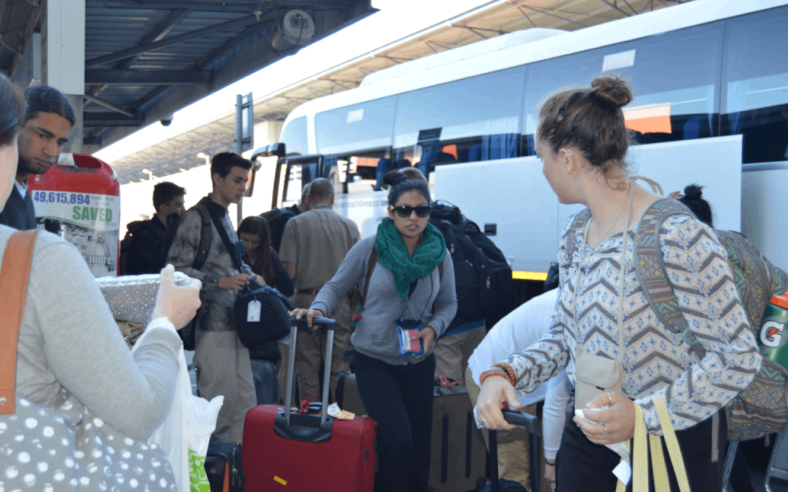 Passengers Disembarking from a Luxury Coach